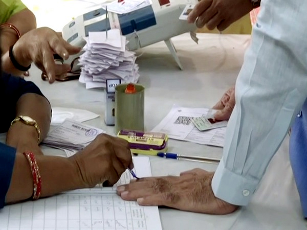 a voter gets his finger marked with indelible ink before casting his vote for the rajasthan assembly elections