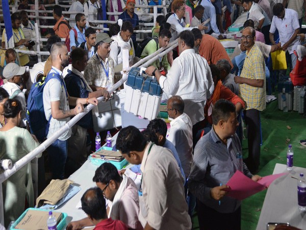 polling officials deposit the evms at the end of voting