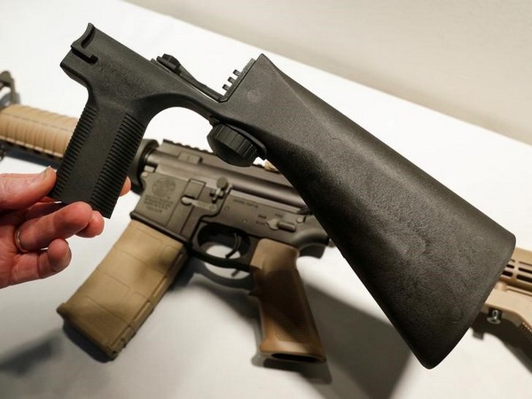 a bump fire stock that attaches to a semi automatic rifle to increase the firing rate is seen at good guys gun shop in orem