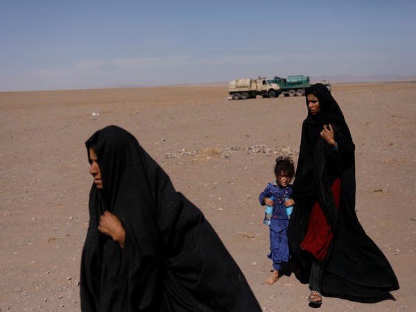 afghan women walk after the recent earthquake in the district of zinda jan, in herat